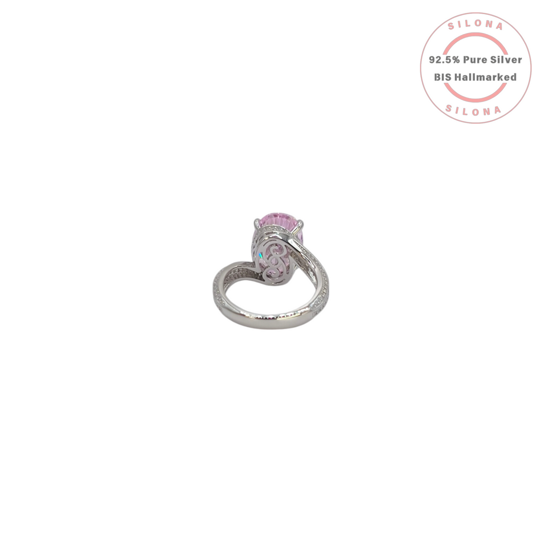 Front view of a statement silver ring featuring a large oval-cut pink cubic zirconia stone with a pavé-set split shank band on a white background.