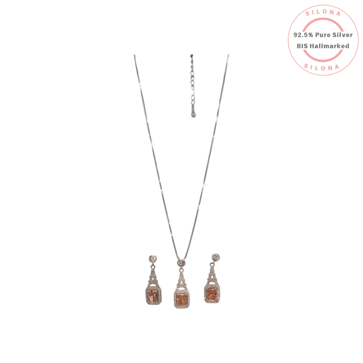 Silona Vintage Halo Necklace and Earring Set in 92.5 silver, featuring a large, emerald-cut peach cubic zirconia surrounded by a clear stone halo on a white background.