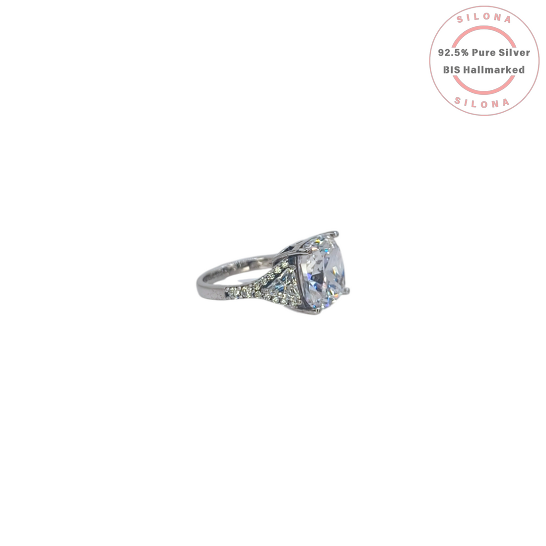 Silona's Classic Cushion Cut Trilogy Ring featuring a large central cubic zirconia stone flanked by two trilliant-cut stones, set in 92.5 hallmarked silver.