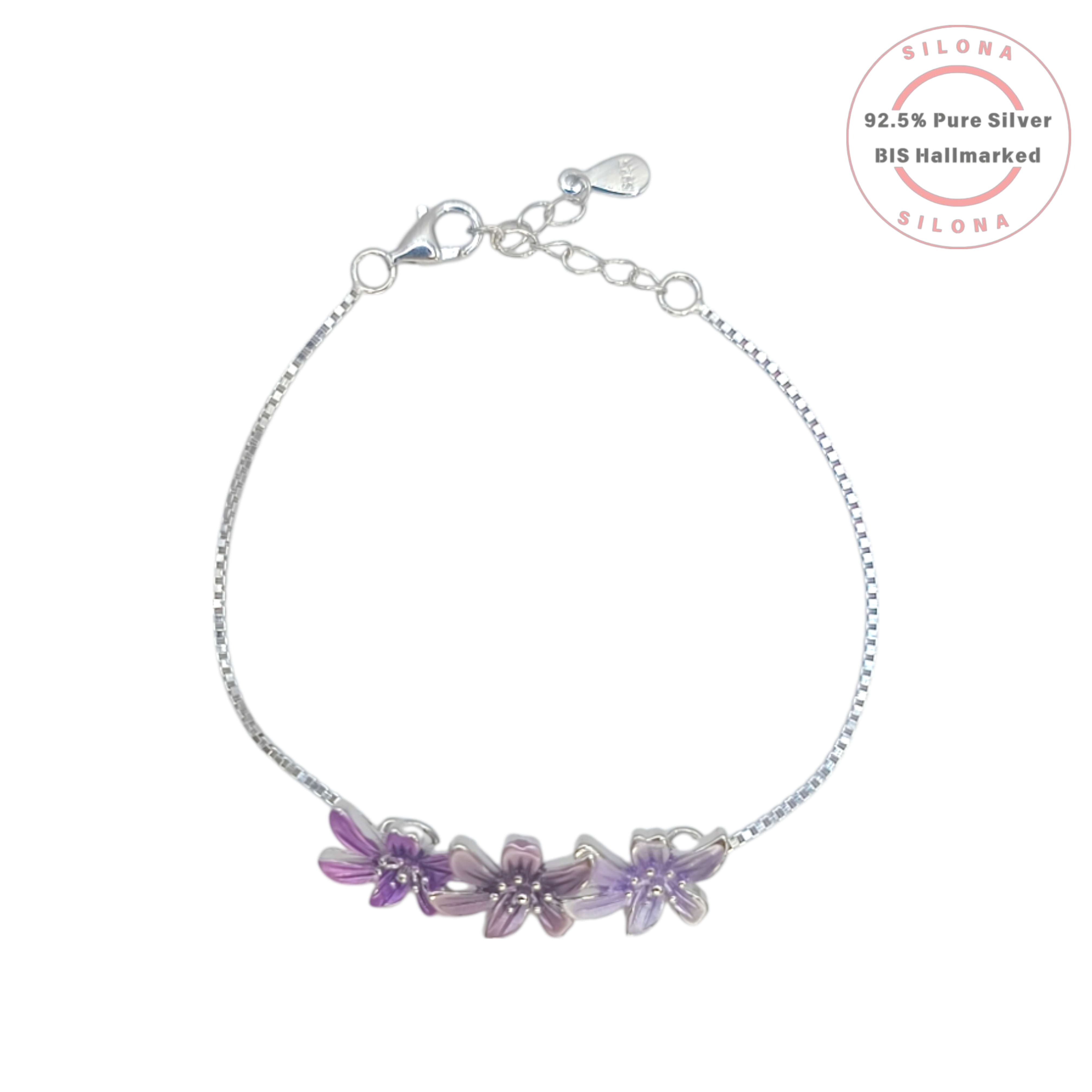 A delicate silver box chain bracelet with three enamel flowers in shades of purple and lavender, crafted from 92.5 pure silver by Silona.