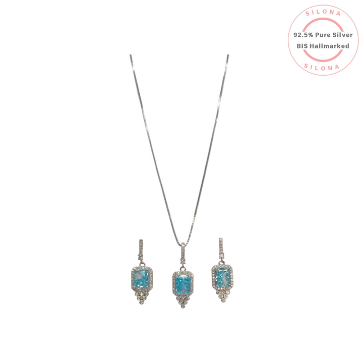 Silona Halo Necklace Set with matching earrings, featuring rectangular aquamarine-hued cubic zirconia stones set in 92.5 silver.