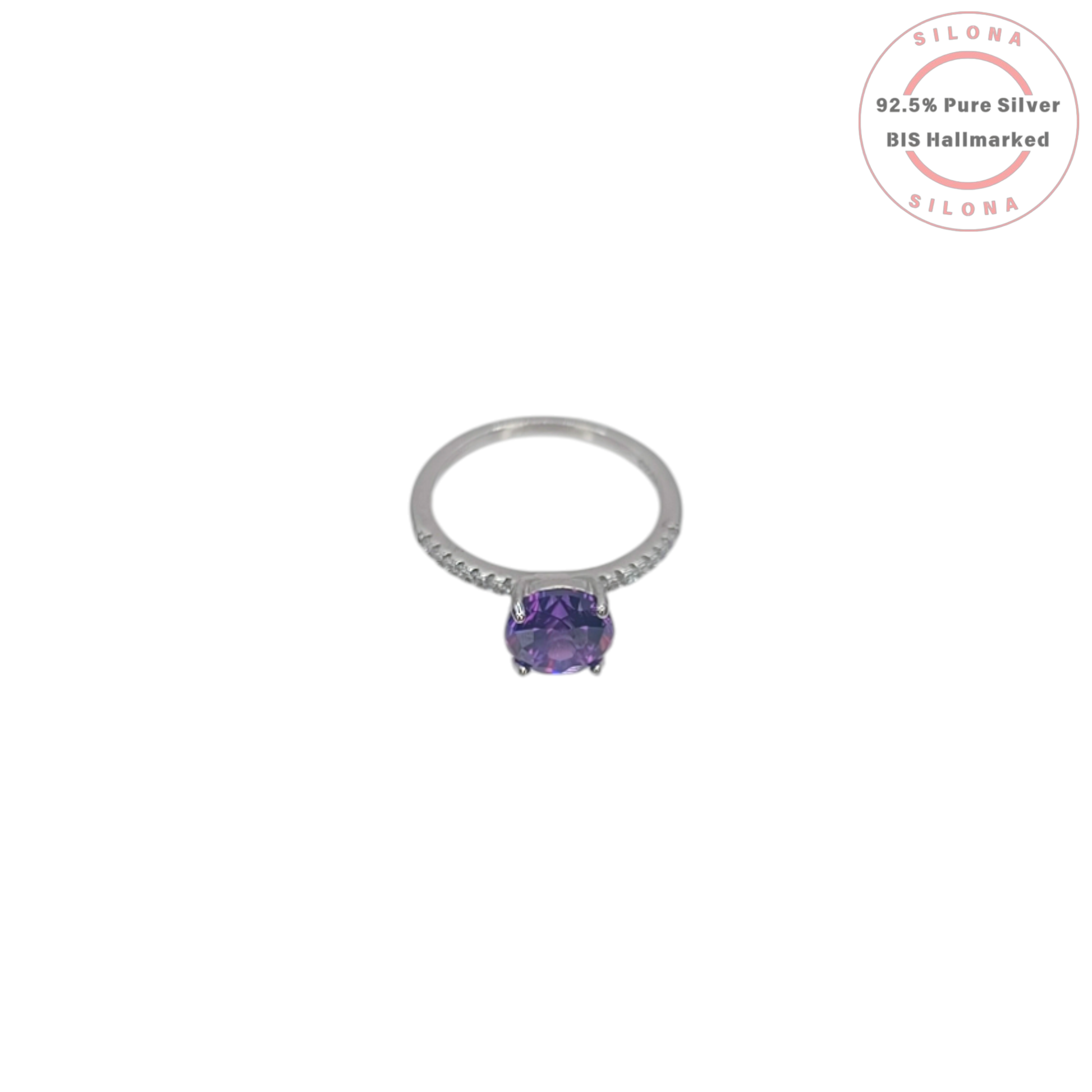 A classic solitaire ring crafted in 92.5 silver, featuring a large, round, deep purple center stone with pavé-set cubic zirconia on the band, shown on a white background.