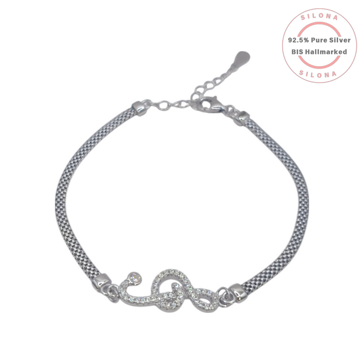 Silona's Sparkling Melody Treble Clef Bracelet in pure 92.5 silver, featuring a pave cubic zirconia motif on a woven chain against a white background.
