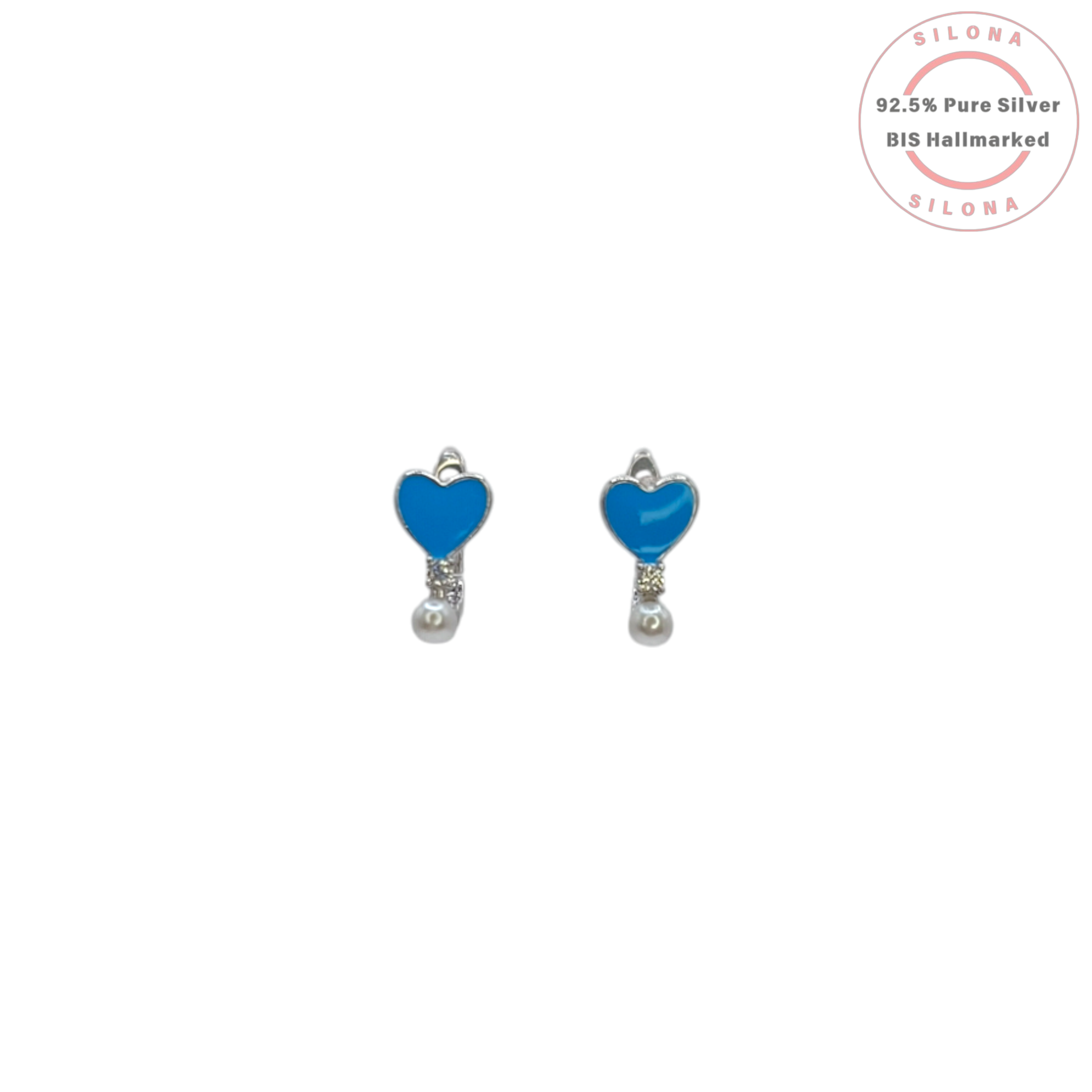 Pair of Silona silver huggie earrings featuring a bright blue enamel heart, pavé cubic zirconia, and a single white pearl drop, on a white background.