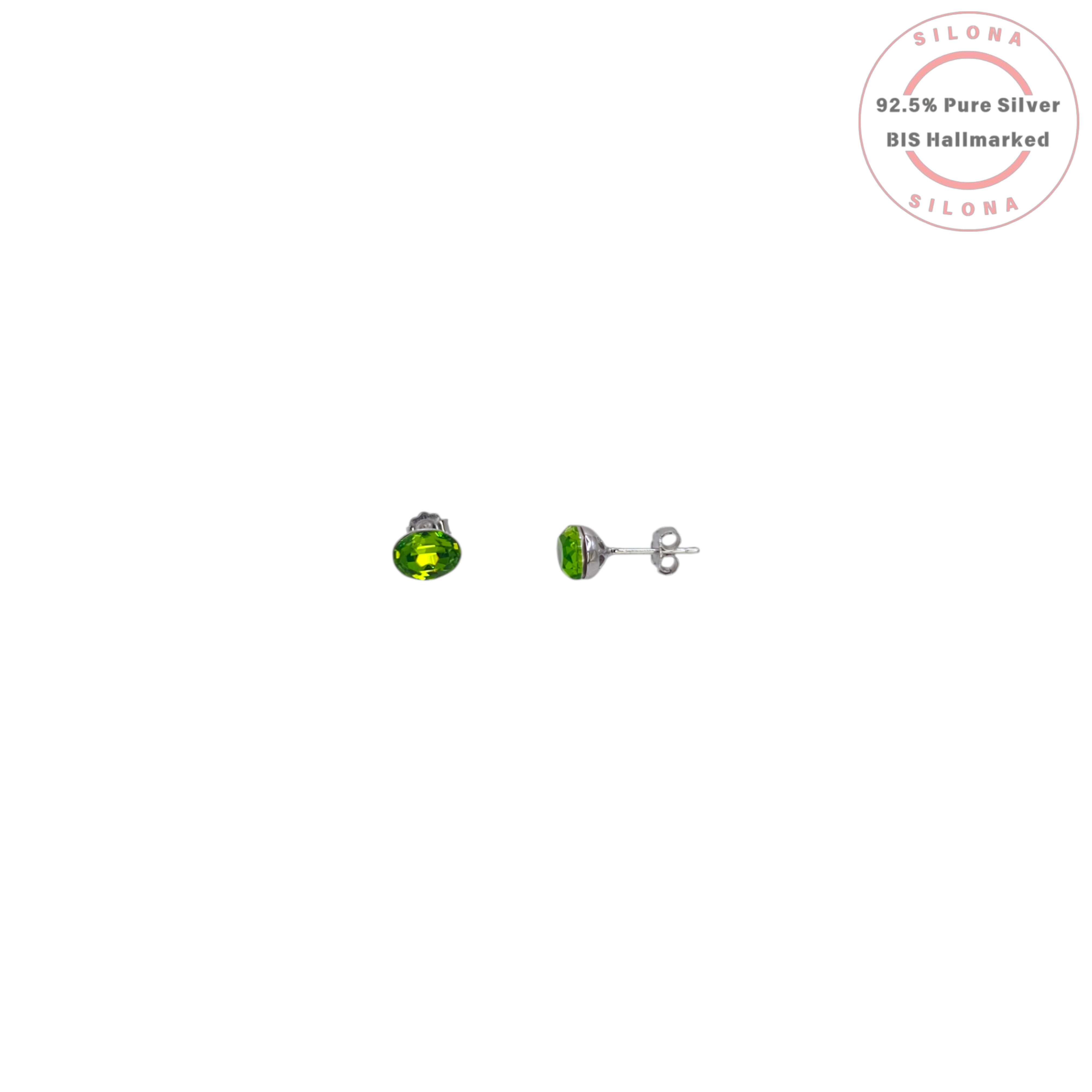 A pair of classic oval-cut stud earrings featuring vibrant peridot-green faceted crystals, set in silver, displayed on a white background with the Silona hallmark.