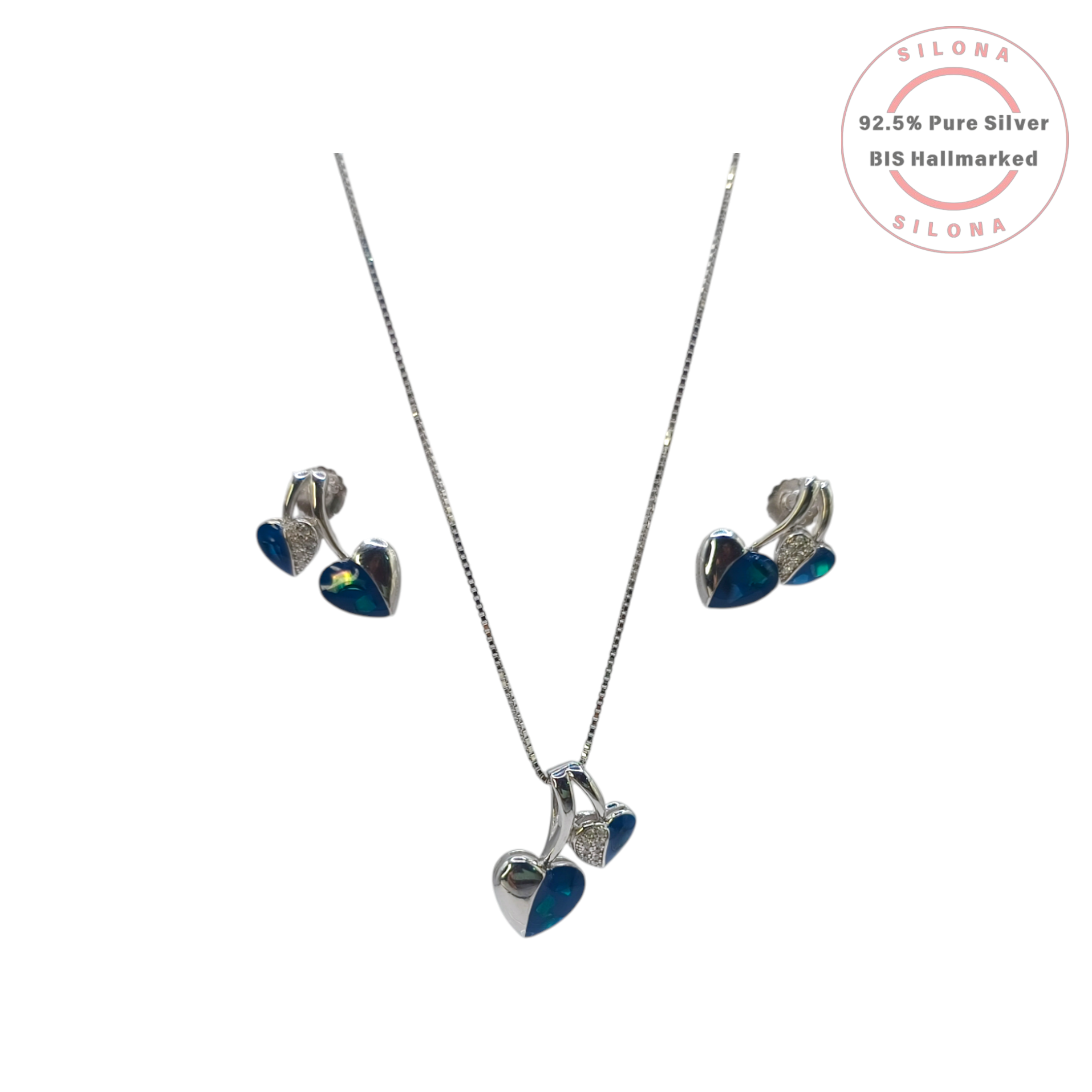 Silona's Modern Twin Heart Stud Earrings in 92.5 silver, featuring one half with blue enamel and the other half with pavé-set cubic zirconia, on a white background.