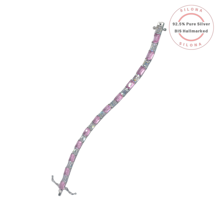 An elegant tennis bracelet with alternating pink and white emerald-cut cubic zirconia stones, crafted from 92.5 pure silver, on a white background with the Silona hallmark.