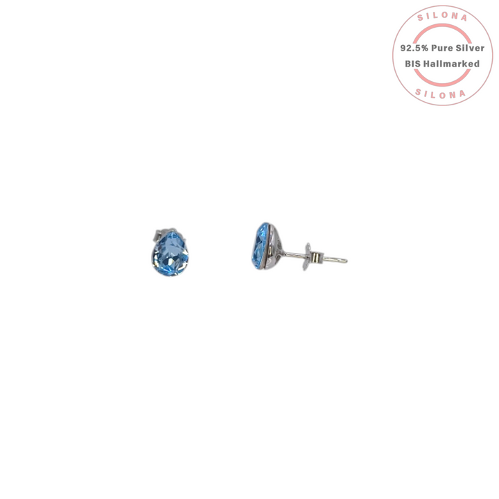 Pair of minimalist pear-cut stud earrings with vibrant blue topaz hue stones, crafted from 92.5 silver.