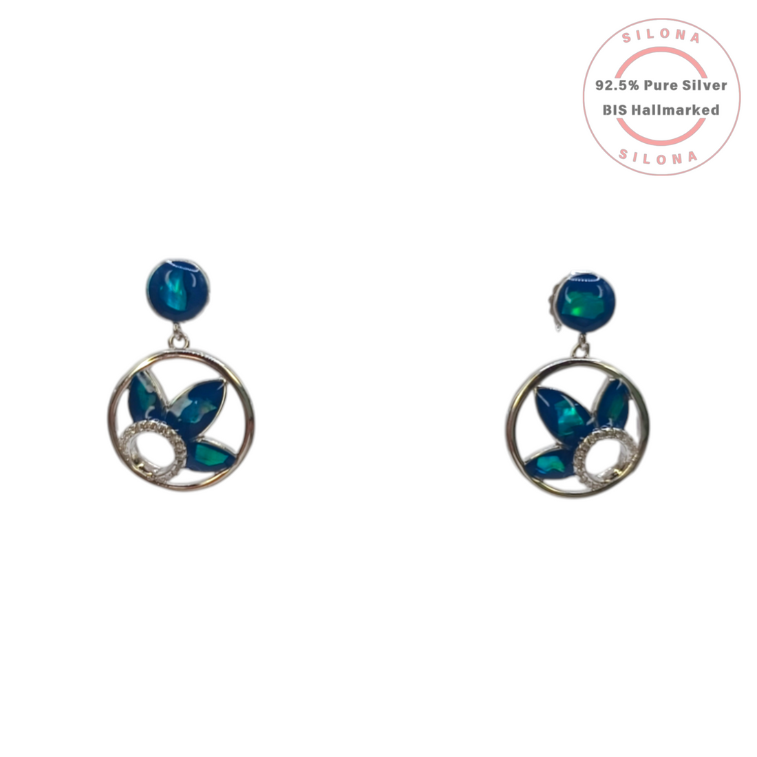 A pair of Silona's Azure Petal silver drop earrings, featuring a circular frame with peacock teal petals and a pavé cubic zirconia accent, on a white background.