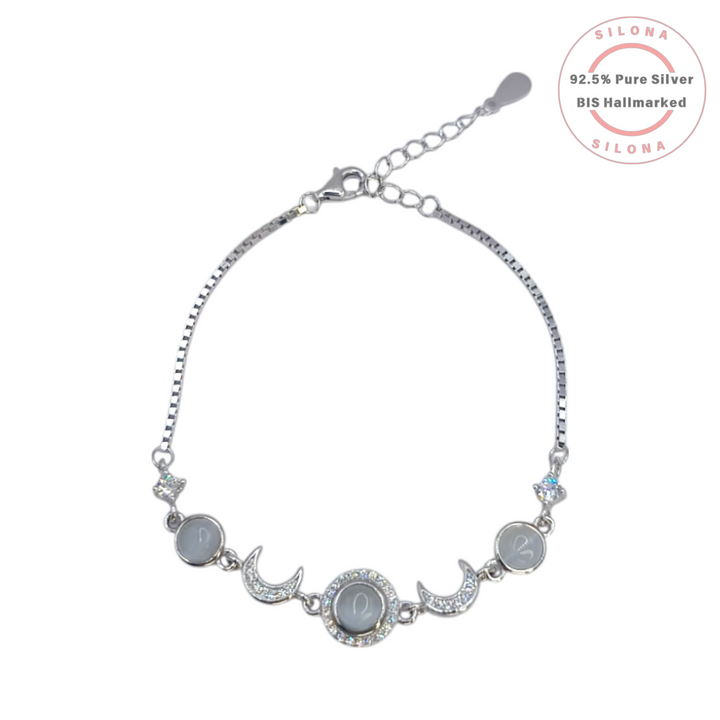 Silona's Celestial Moon & Star Bracelet in 92.5 silver, featuring a central grey cat's eye stone, sparkling crescent moons, and a box chain, on a white background.