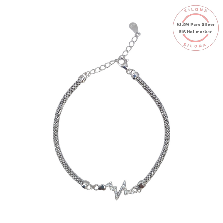 Silona Sparkling Heartbeat Bracelet in 92.5 Silver with a woven chain and a central EKG motif paved with cubic zirconia, on a white background.