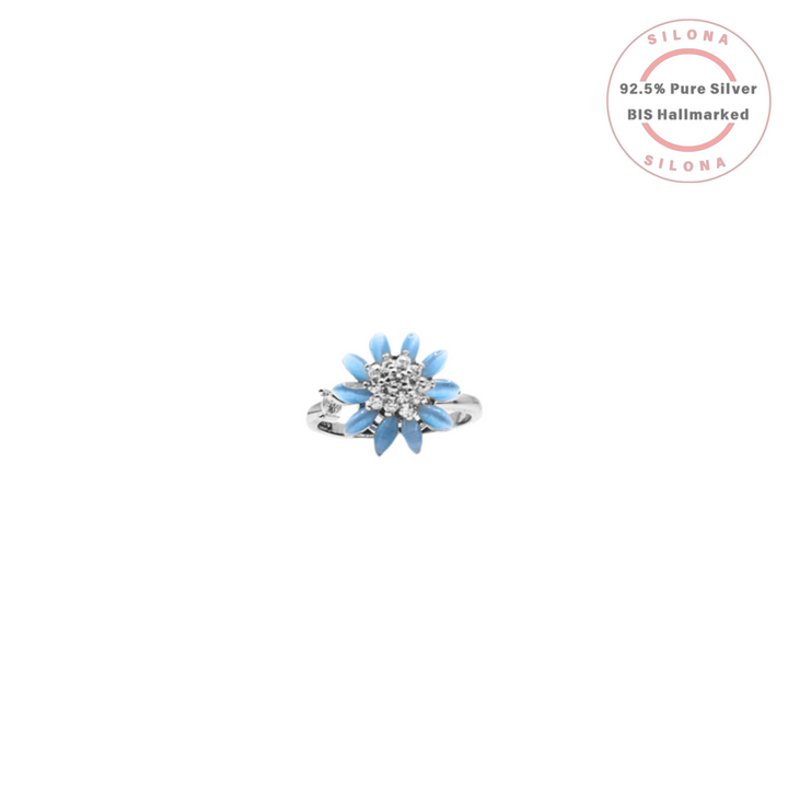 Front view of the Silona Aqua Blossom Floral Ring, featuring aqua blue petals and a cubic zirconia center on a pure 92.5 silver band.