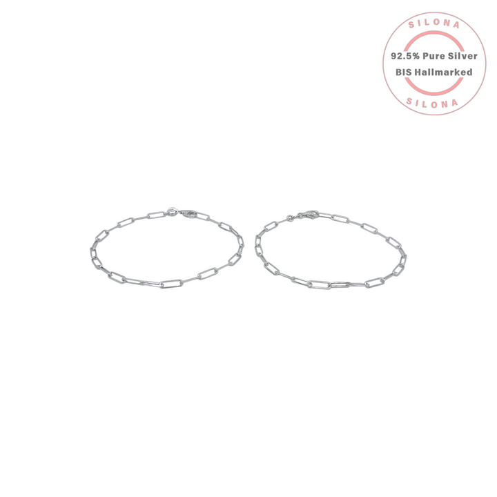 A pair of sleek paperclip chain bracelets crafted from polished 92.5 sterling silver, arranged on a clean white background with the Silona hallmark logo.