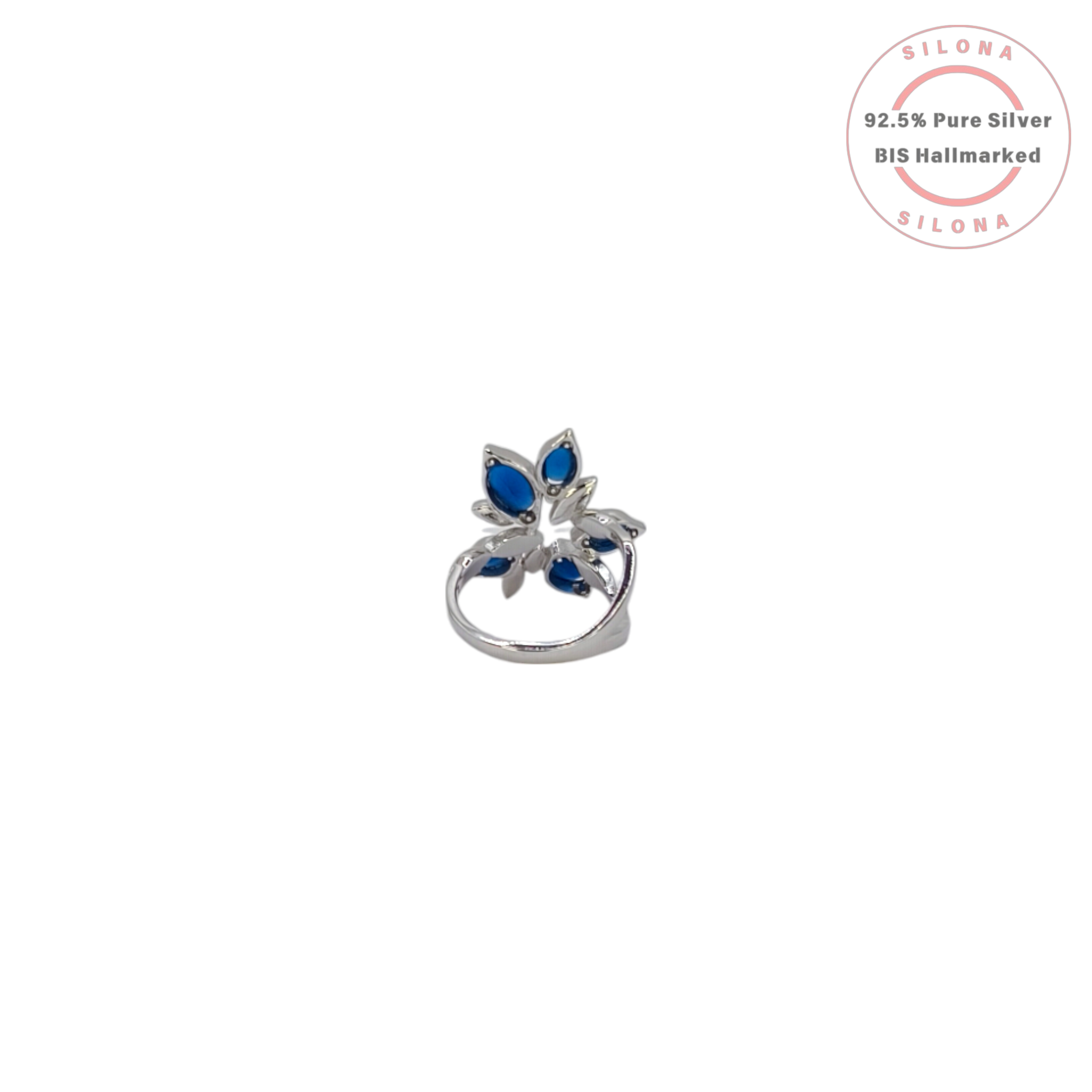 A modern floral statement ring in 92.5 silver, featuring marquise-cut sapphire-blue stones and pavé cubic zirconia, on a white background.