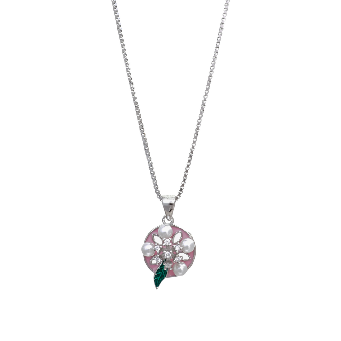 Silver chain necklace holding a round pink enamel pendant decorated with pearl petals, crystal cluster center, and a small green leaf.