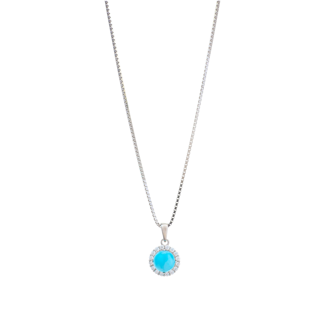 A silver box chain necklace showcasing a vibrant round turquoise cabochon pendant encircled by a halo of clear cz stones.