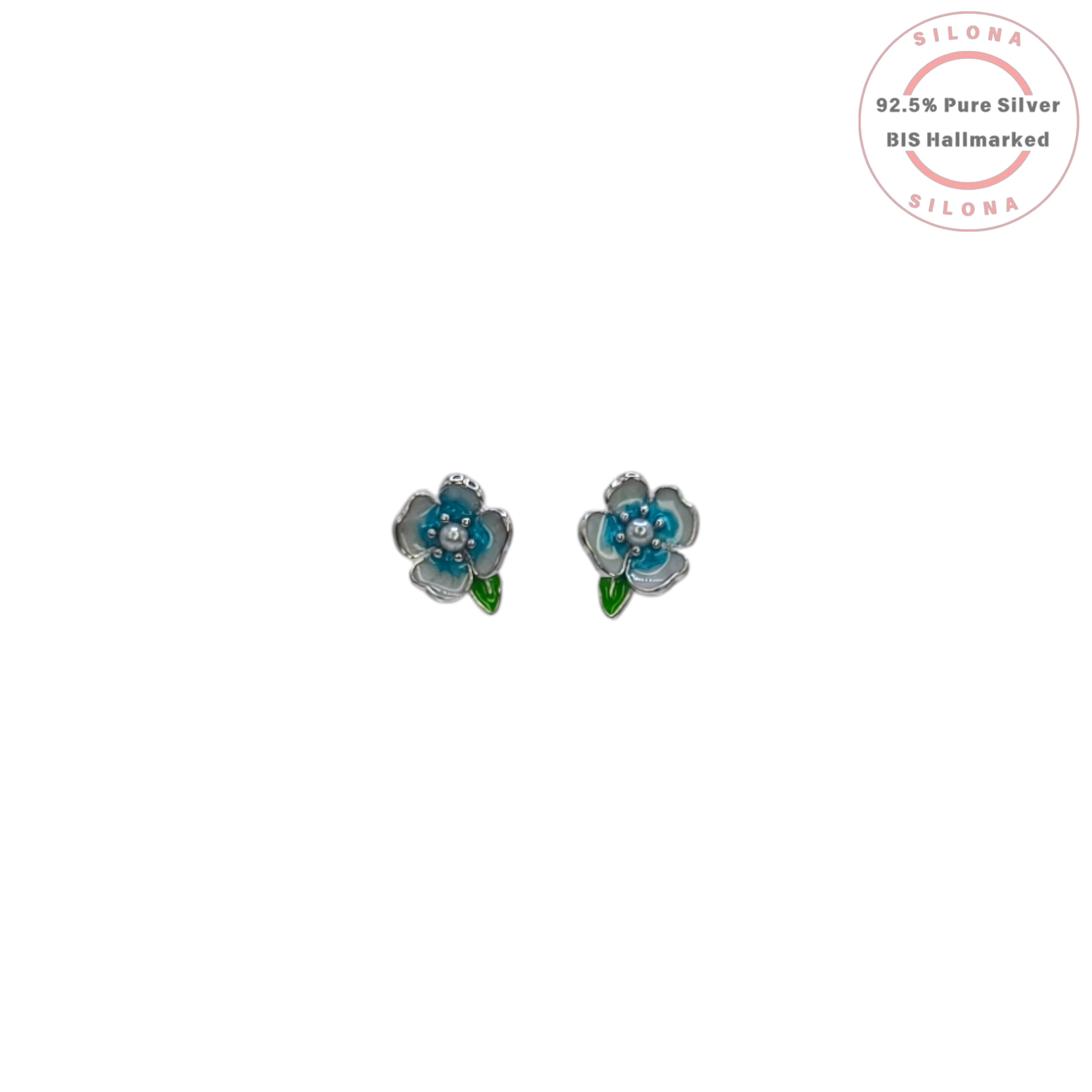 A pair of Silona silver stud earrings shaped like small blue and white enamel flowers with a green leaf, on a white background.