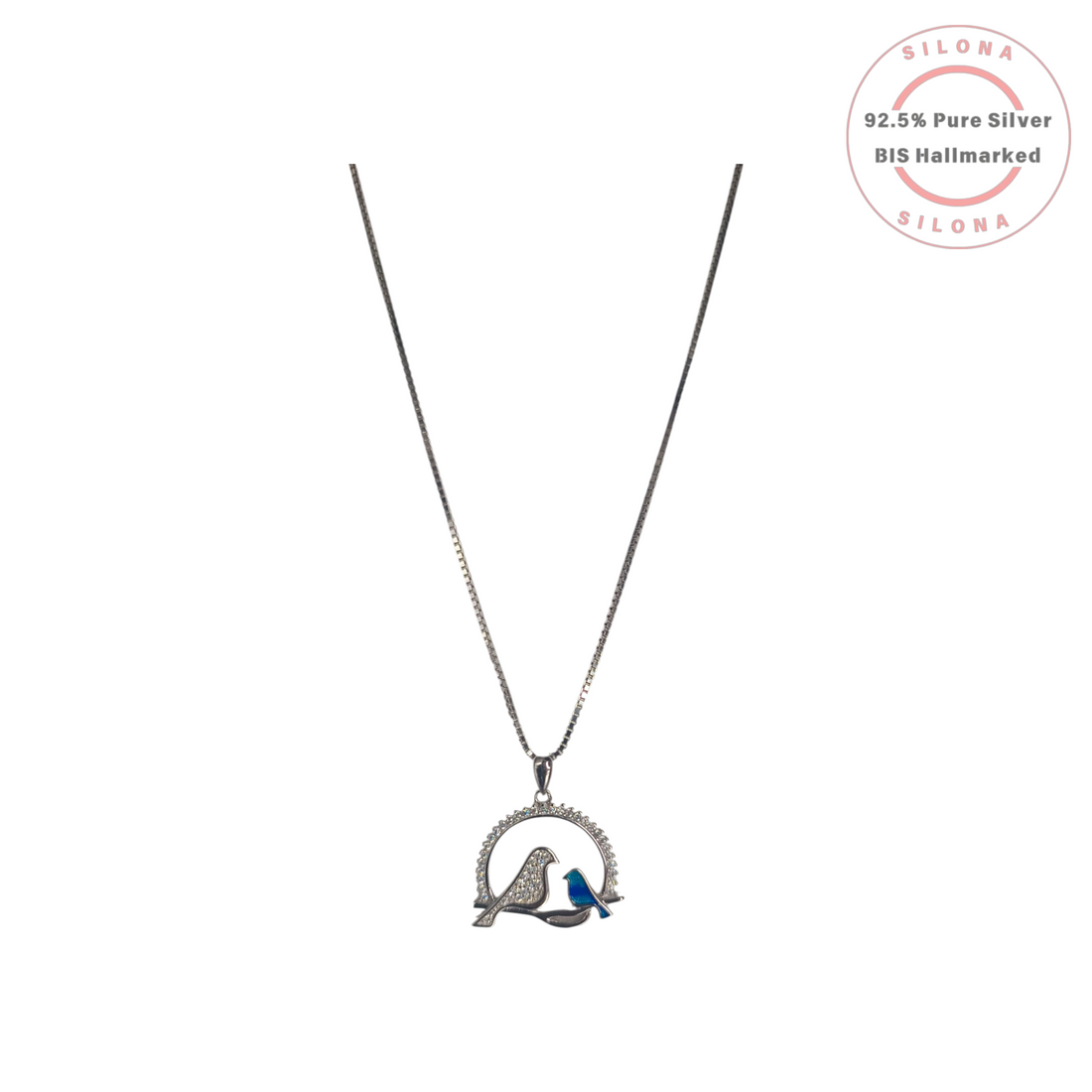 Silona's Sparkling Lovebird Pendant Necklace in 92.5 silver, featuring a pavé cubic zirconia bird beside a smaller cobalt blue enamel bird on a branch.