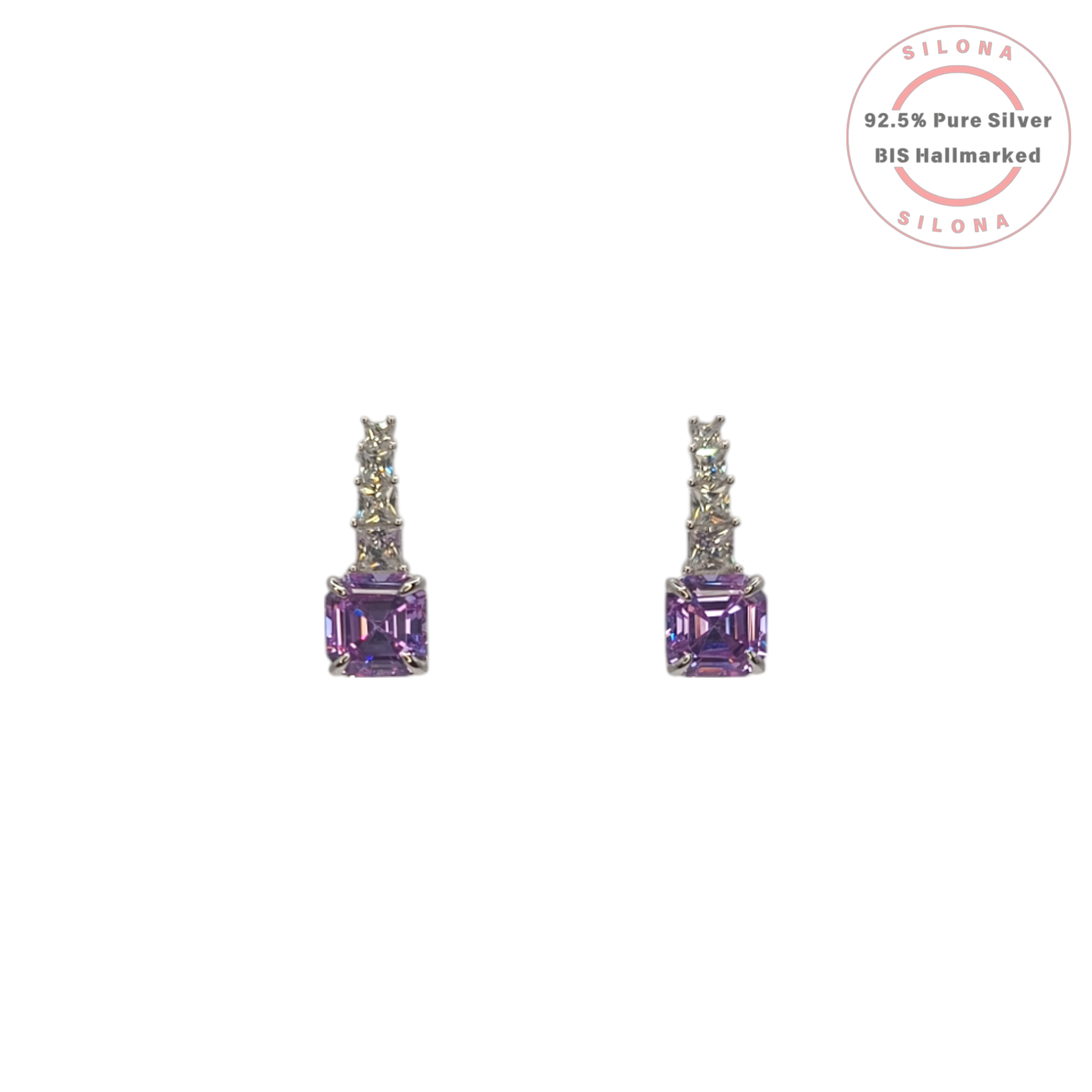 A pair of silver drop earrings featuring a large, square, Asscher-cut purple stone, hanging from a vertical line of smaller clear stones, on a white background.