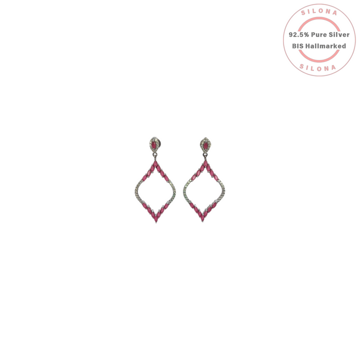 A pair of Silona silver drop earrings in a geometric rhombus shape, set with marquise-cut ruby-hued stones and clear pavé crystals, on a white background.