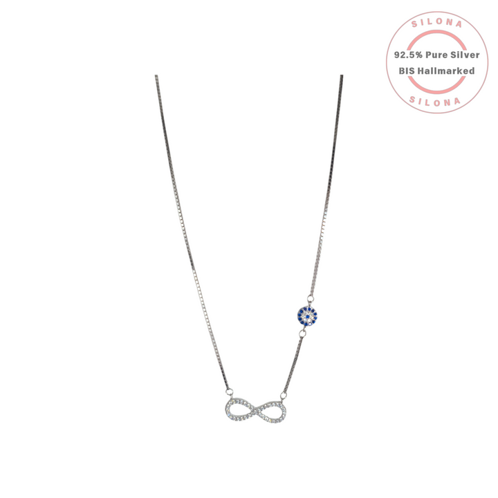 Delicate 92.5 silver necklace featuring a cubic zirconia infinity symbol pendant and an asymmetric blue and white evil eye charm on a box chain.