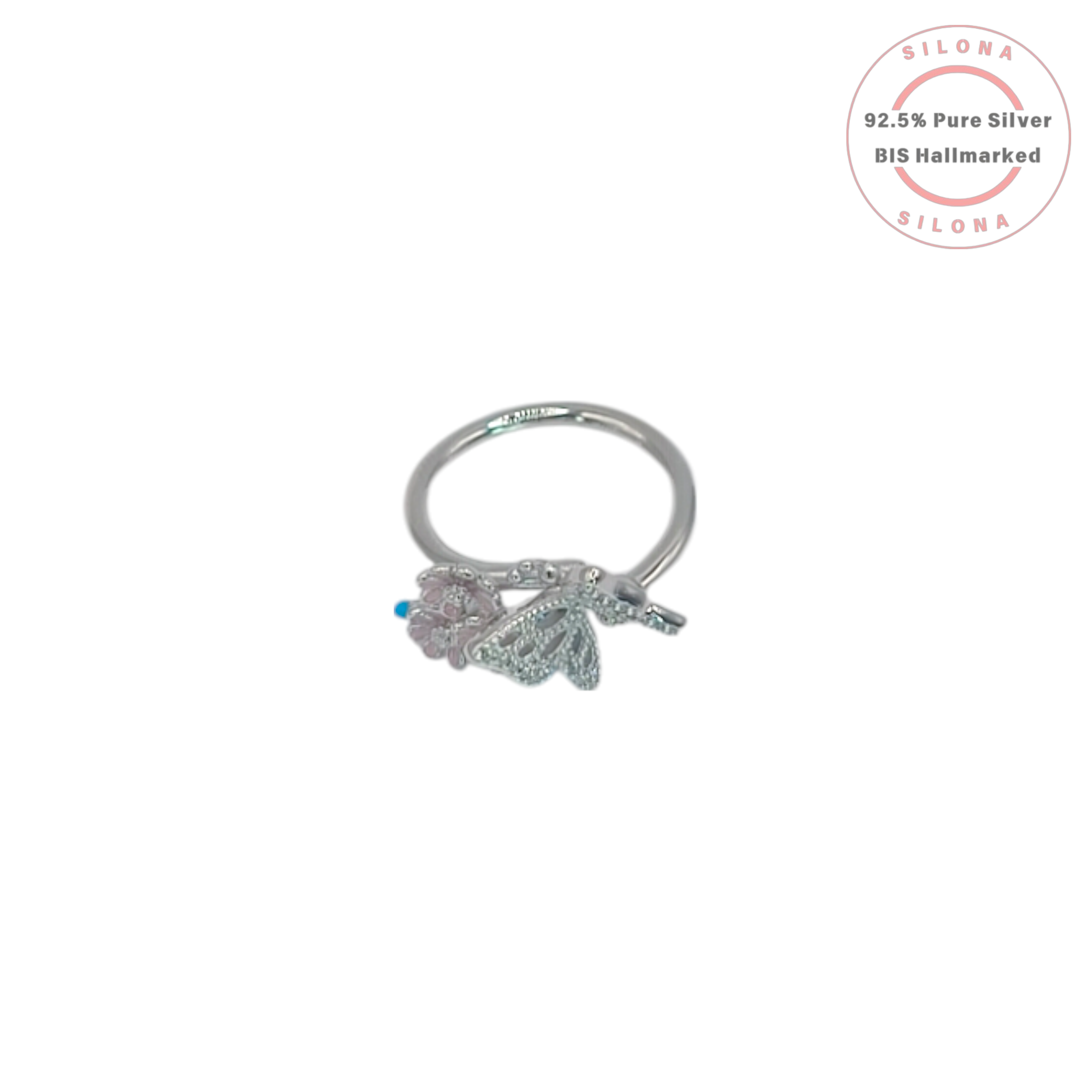 A sterling silver ring featuring a pavé cubic zirconia butterfly alongside a trio of pastel pink enamel flowers, shown on a white background.