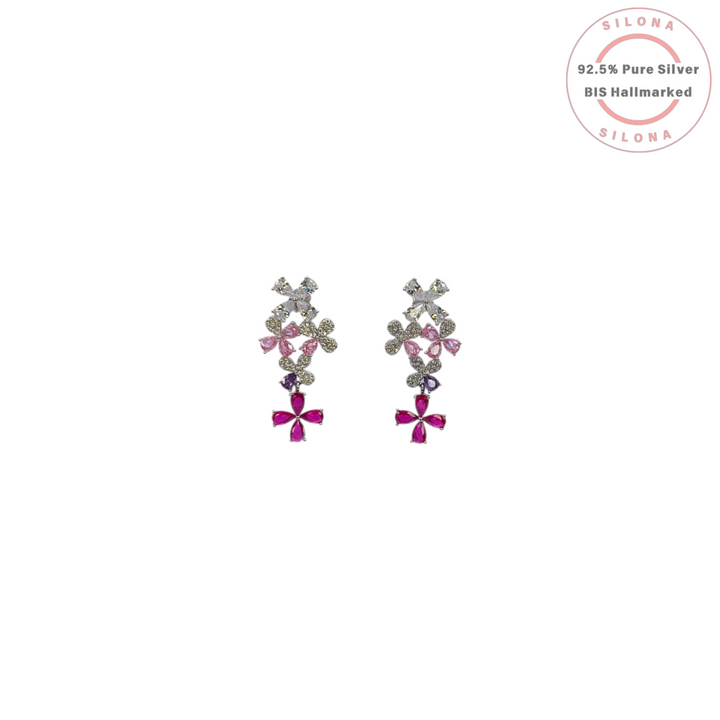 A pair of Silona cascading floral drop earrings in 92.5 silver, featuring multi-colored cubic zirconia in pink, ruby, and clear hues.
