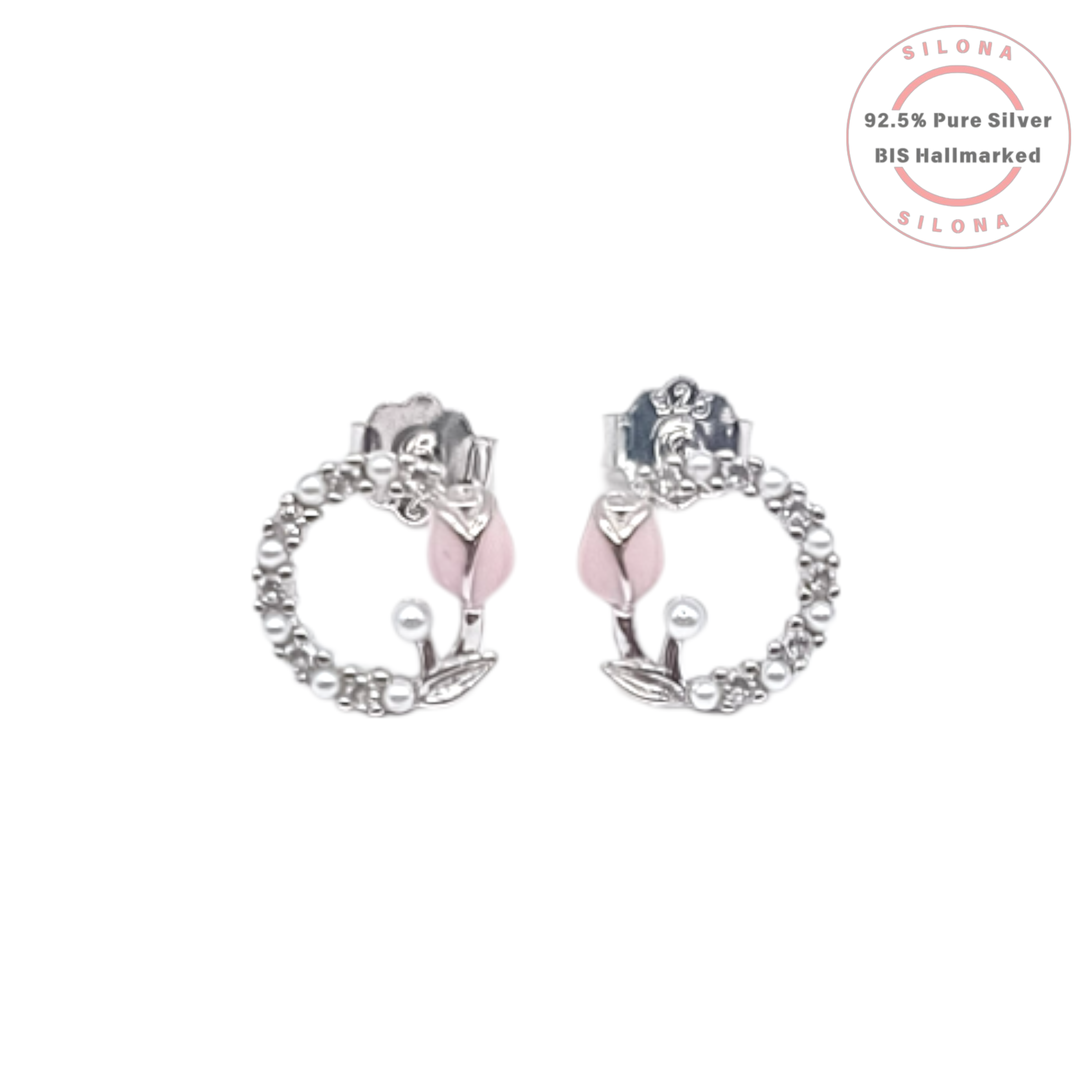A pair of Silona silver stud earrings featuring a blush-pink enamel tulip inside a wreath of tiny white pearls, on a white background.