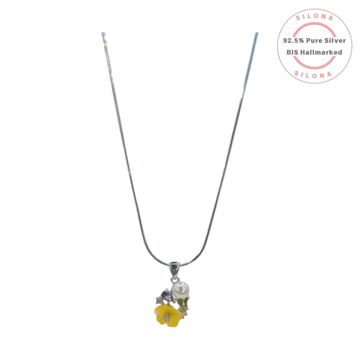 Silona floral necklace and earring set featuring a yellow enamel flower, a white pearl, and multi-colored stones, crafted from 92.5 sterling silver on a white background.