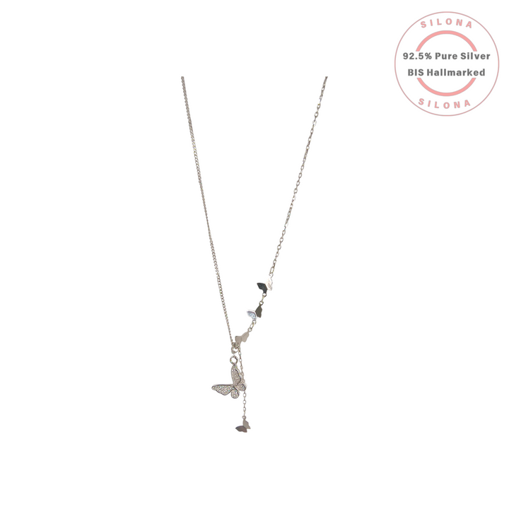 Dainty Pavé Butterfly Lariat Necklace in 92.5 sterling silver on a white background.
