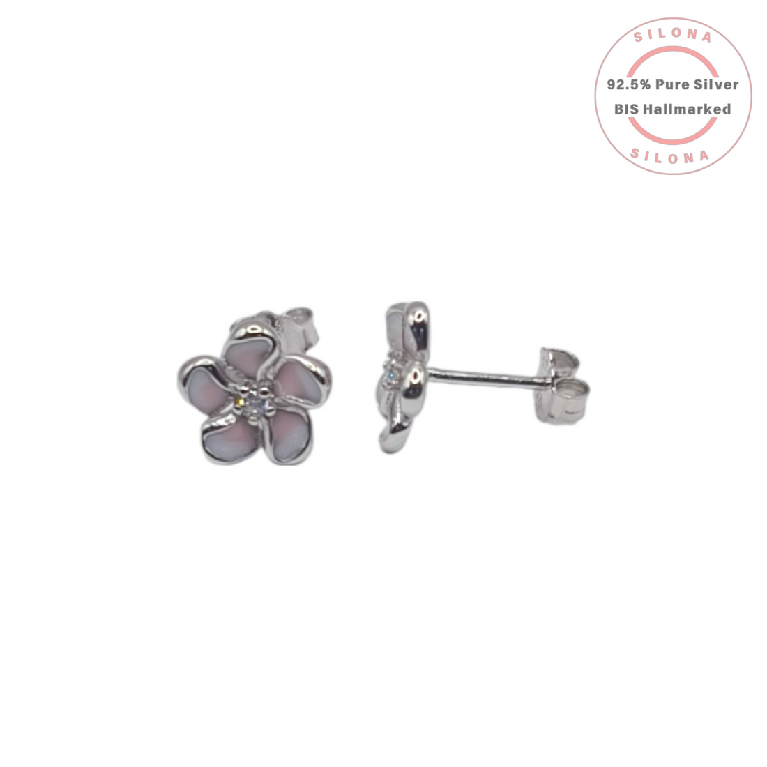 A pair of Silona's silver Plumeria flower stud earrings with soft pink and white enamel petals and a central cubic zirconia, on a white background.