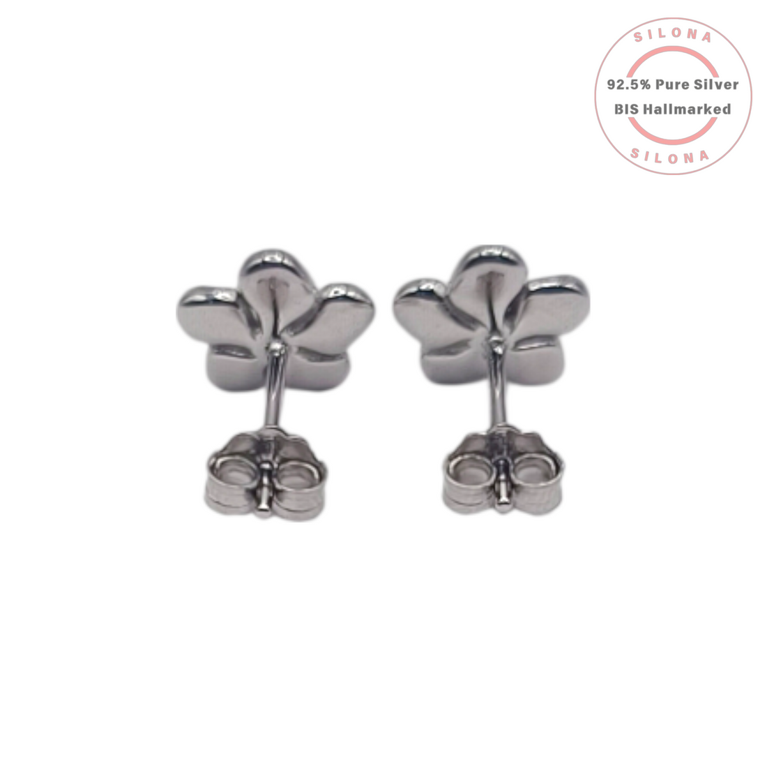 A pair of Silona's silver Plumeria flower stud earrings with soft pink and white enamel petals and a central cubic zirconia, on a white background.