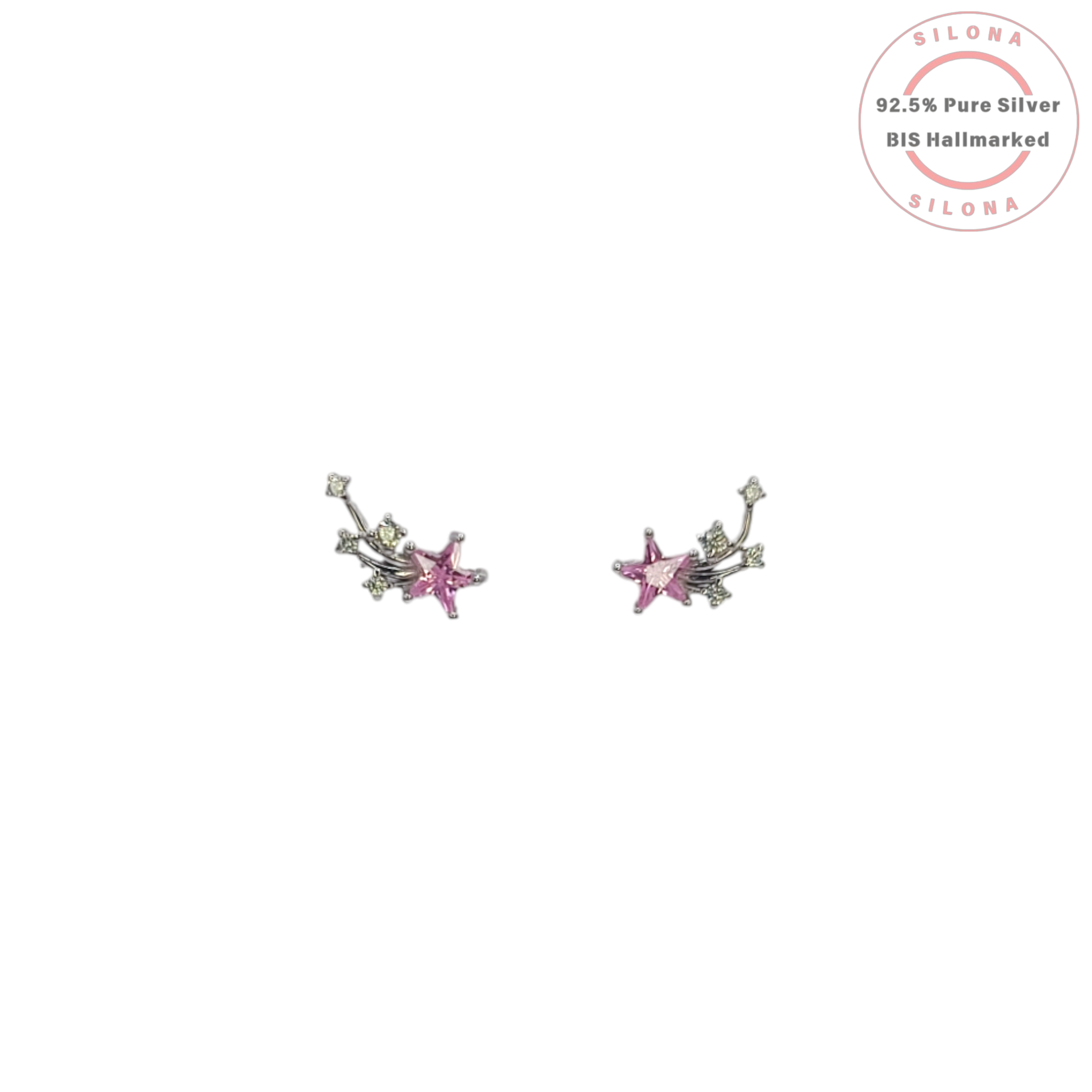 A pair of Cosmic Star Stud Earrings in 92.5 silver, featuring a primary pink star-shaped stone with a trail of smaller peridot-green and clear stones, on a white background.