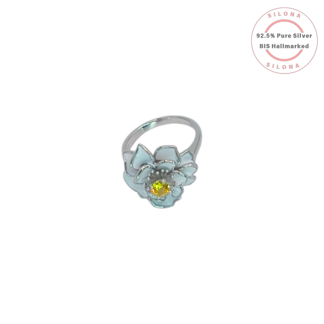 Silona Pastel Bloom Ring in 92.5 silver, featuring a flower design with light blue enamel petals and a central yellow cubic zirconia stone, on a white background.