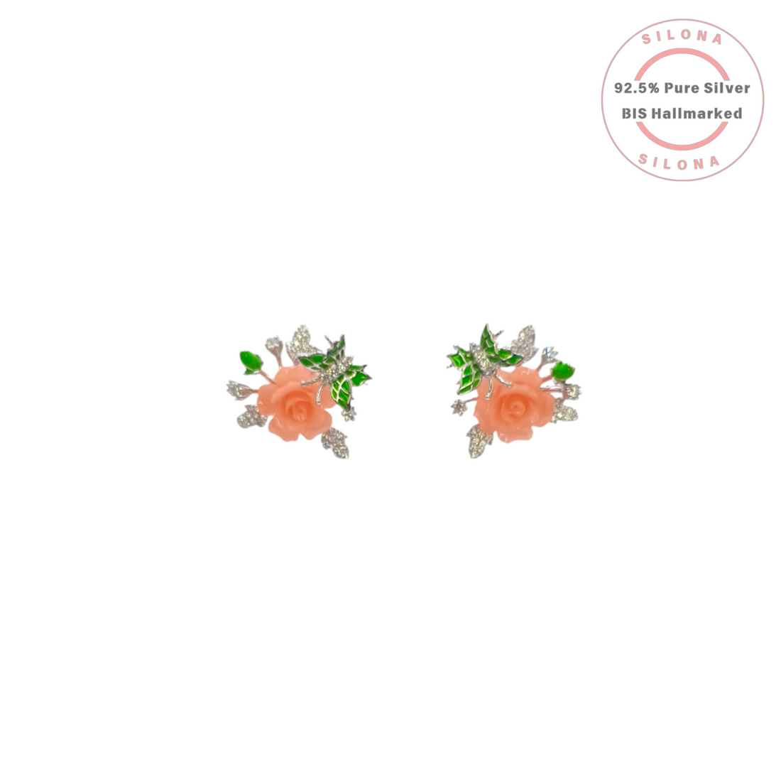 Pair of Silona silver stud earrings featuring a carved coral-colored rose with green enamel leaves and sparkling cubic zirconia accents on a white background.