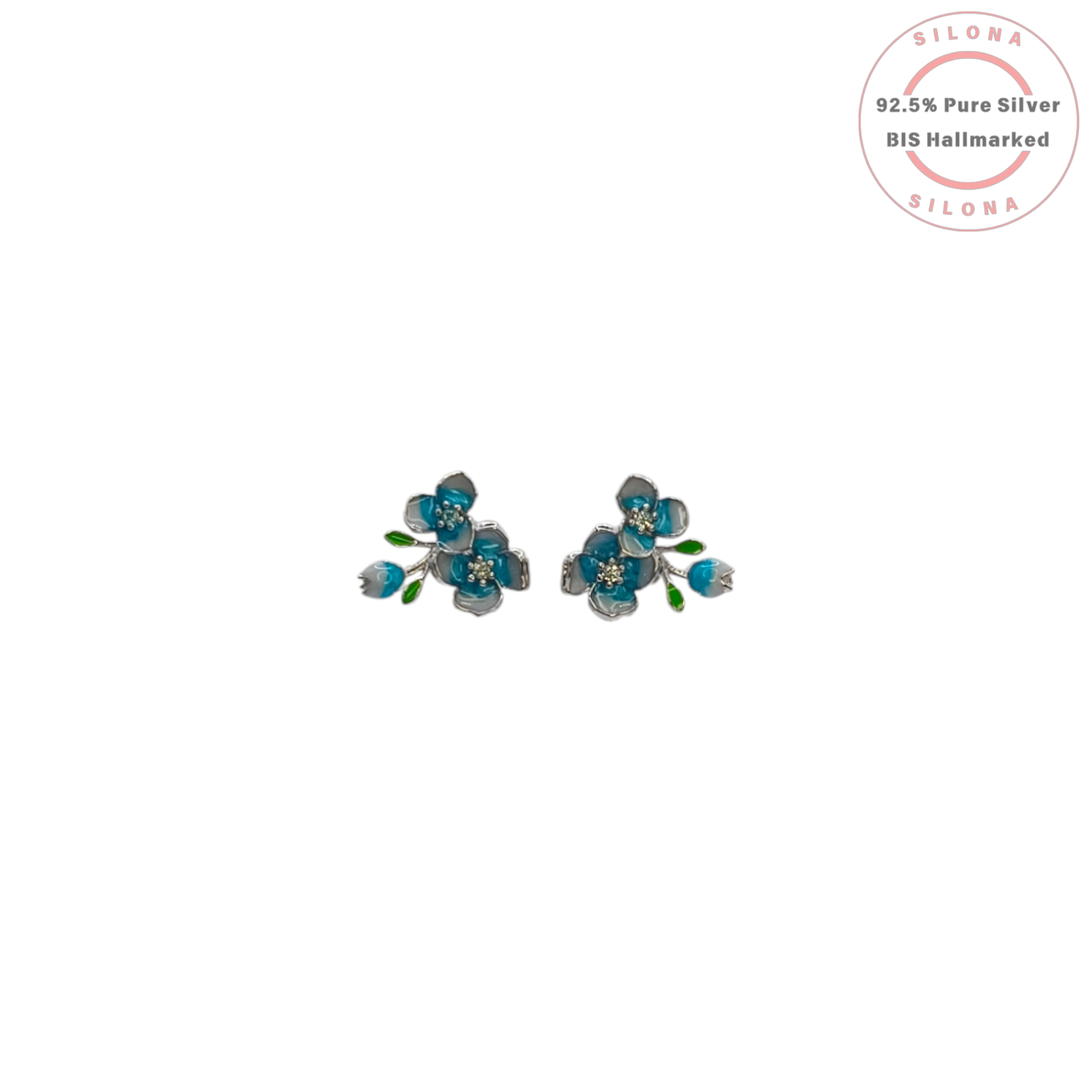 A pair of Silona floral stud earrings crafted in sterling silver, featuring teal and light blue enamel flower petals, green enamel leaves, and a central cluster of sparkling stones.
