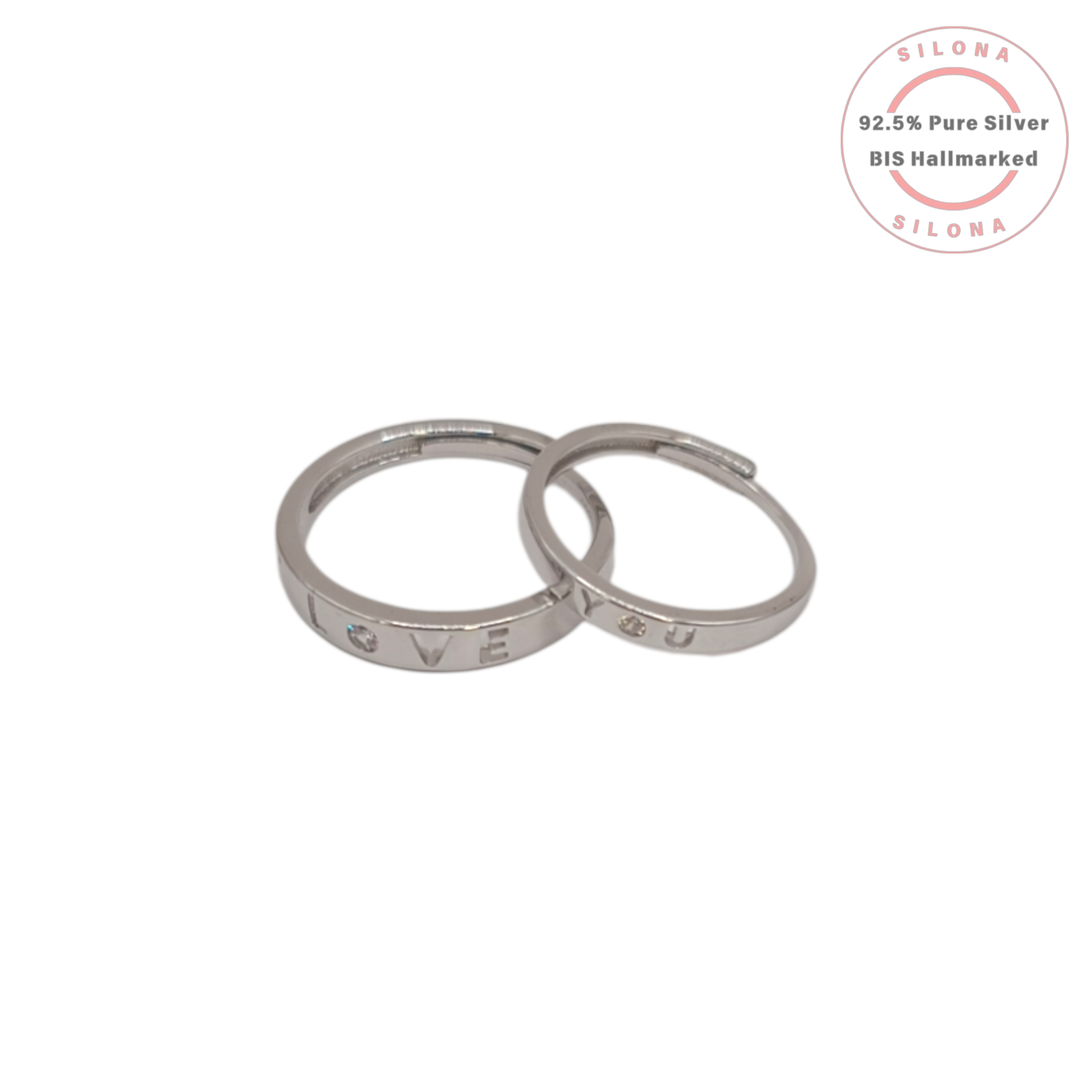 A pair of silver 'Love You' couple's rings, crafted from 92.5 silver with engraved letters and small stone accents, displayed on a white background.