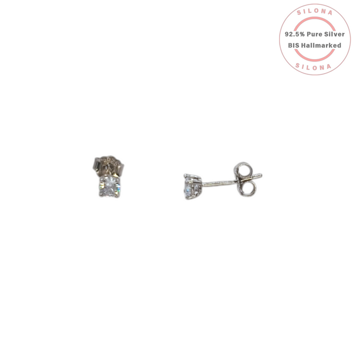 A pair of classic solitaire stud earrings in 92.5 silver, featuring a round-cut cubic zirconia in a four-prong setting, shown on a white background.