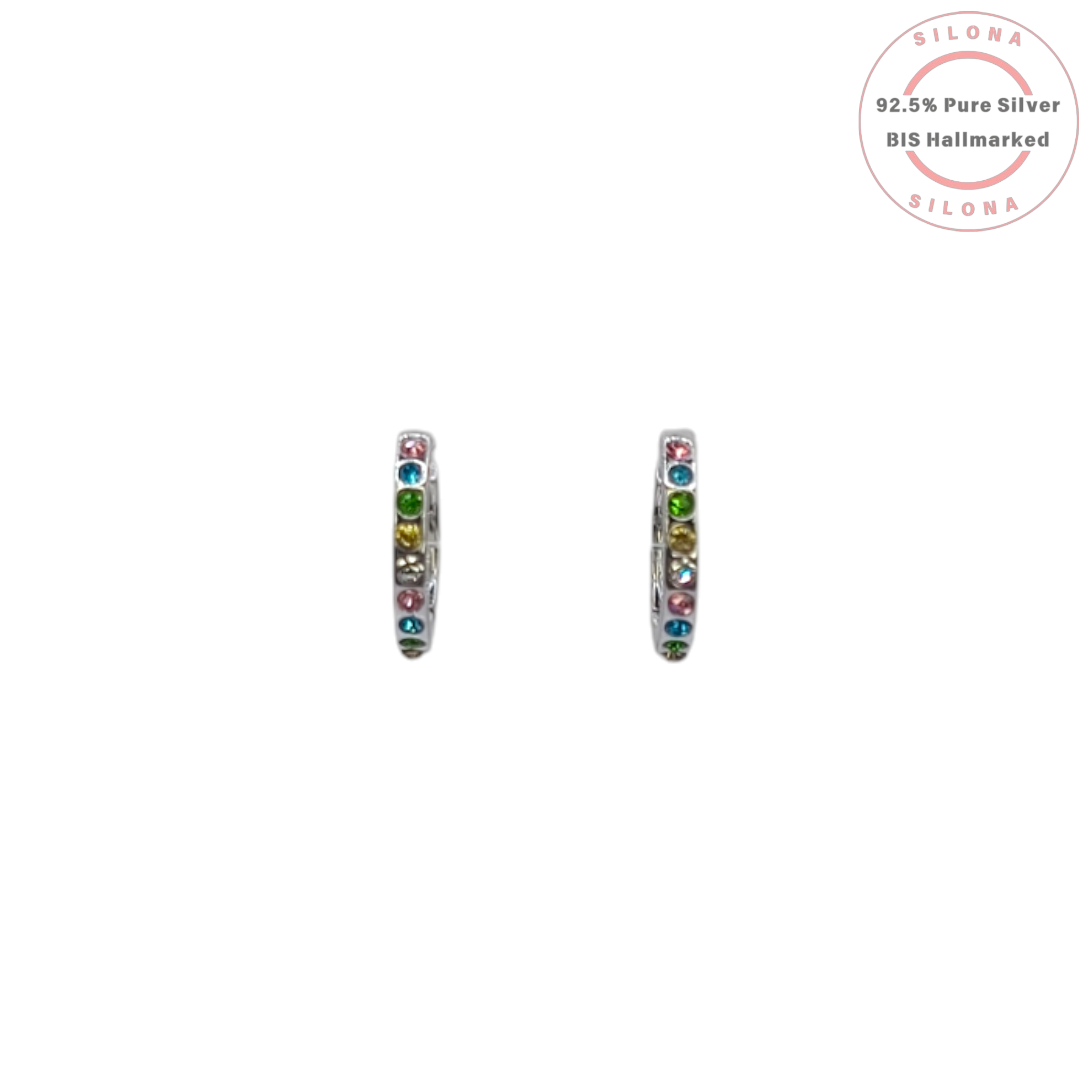 A pair of Silona's rainbow confetti huggie hoop earrings in pure 92.5 silver with multicolored stones, on a white background.