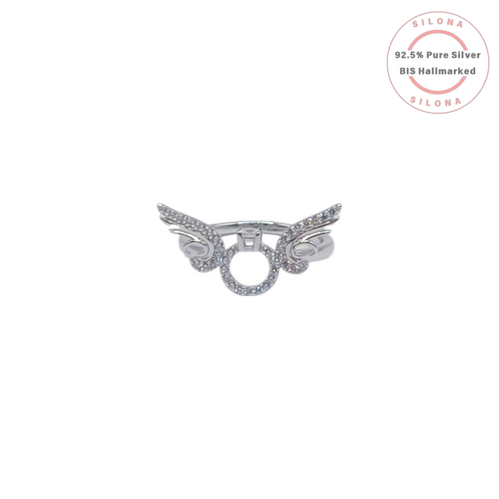Silona Angelic Guardian Wing Ring in 92.5 sterling silver, featuring a central halo and wings studded with cubic zirconia, on a white background.