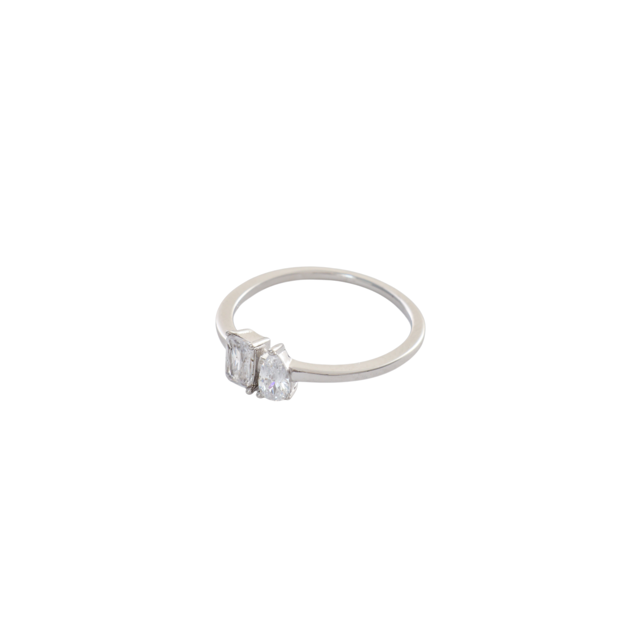 Minimalist silver Toi et Moi ring featuring side-by-side emerald cut and pear cut gems.