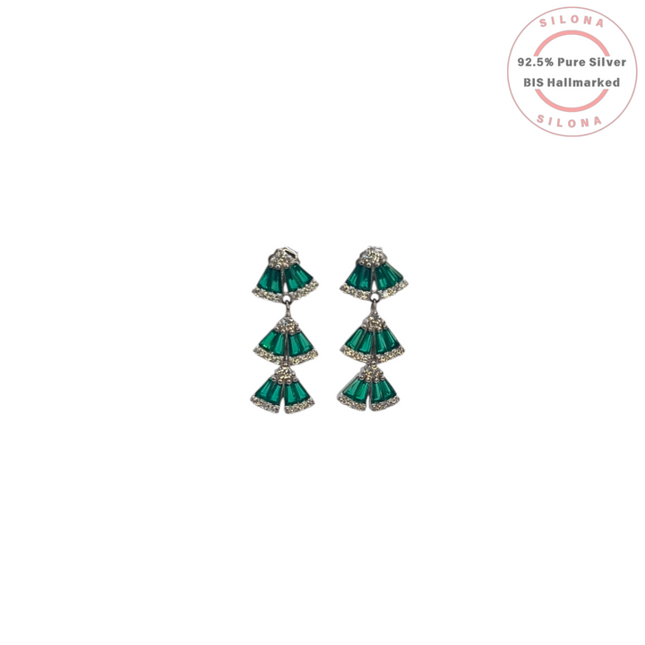 A pair of Art Deco style tiered drop earrings in 92.5 silver, featuring three cascading fan-shaped motifs set with emerald green tapered baguette stones and clear cubic zirconia.