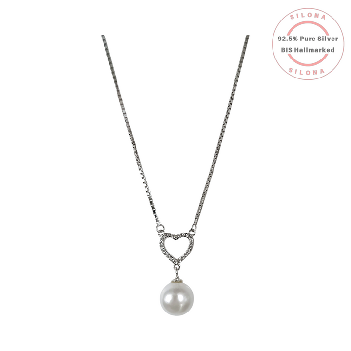 Elegant silver box chain necklace featuring a pave cubic zirconia open heart pendant with a single white pearl drop.