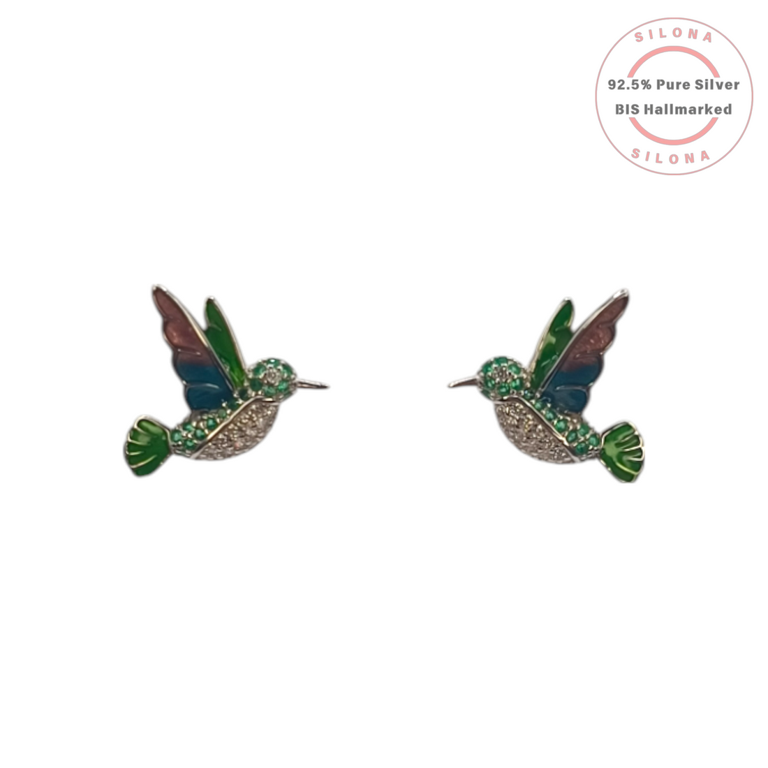 A pair of silver hummingbird stud earrings with multi-color enamel wings and sparkling cubic zirconia, set against a white background.