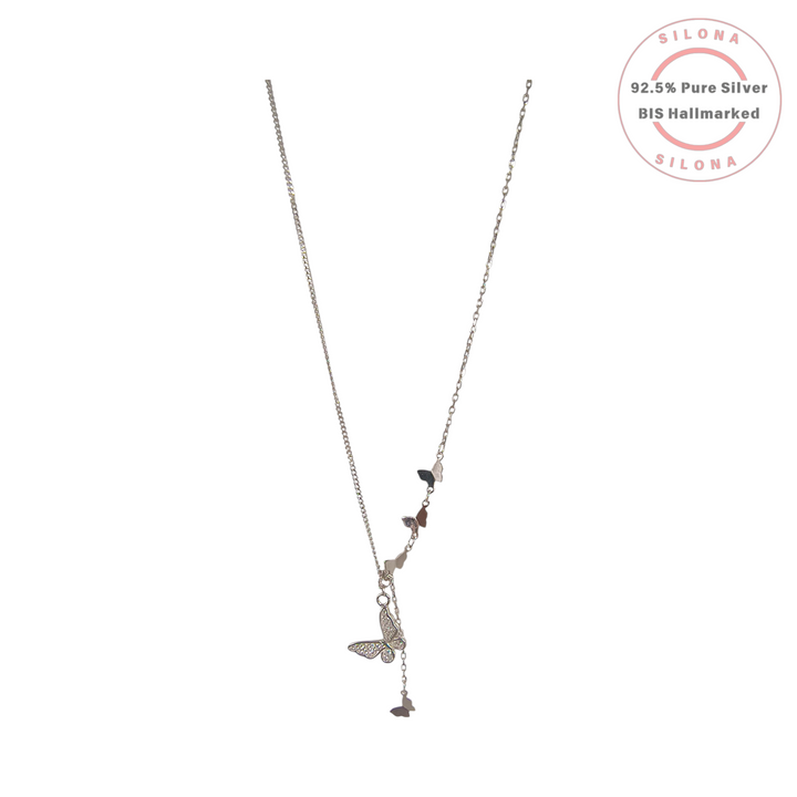 A silver lariat necklace featuring a central pave cubic zirconia butterfly with smaller polished butterfly charms accenting the chain.