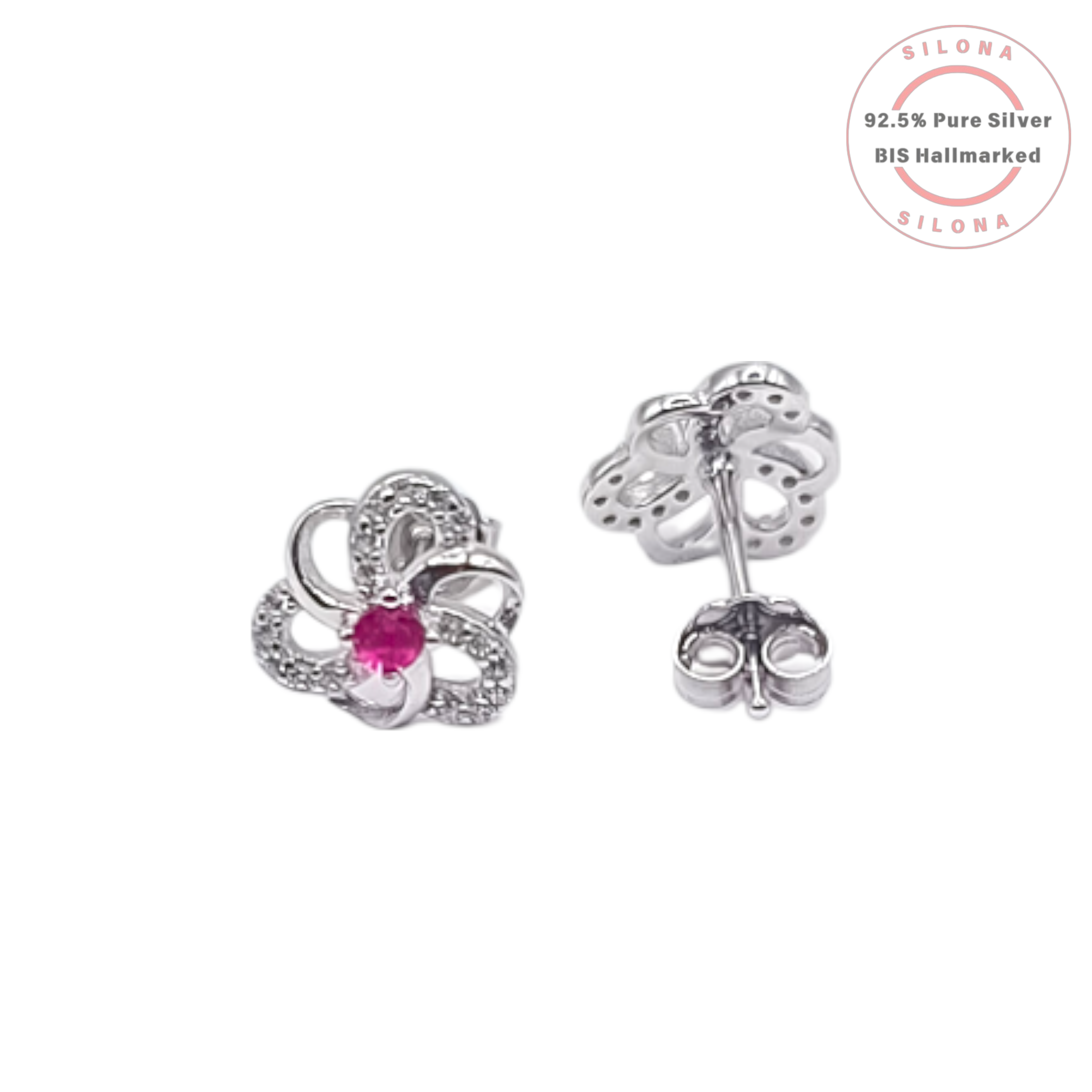 A pair of Silona silver floral stud earrings, each with a central ruby-pink stone and petals paved with clear cubic zirconia, on a white background.
