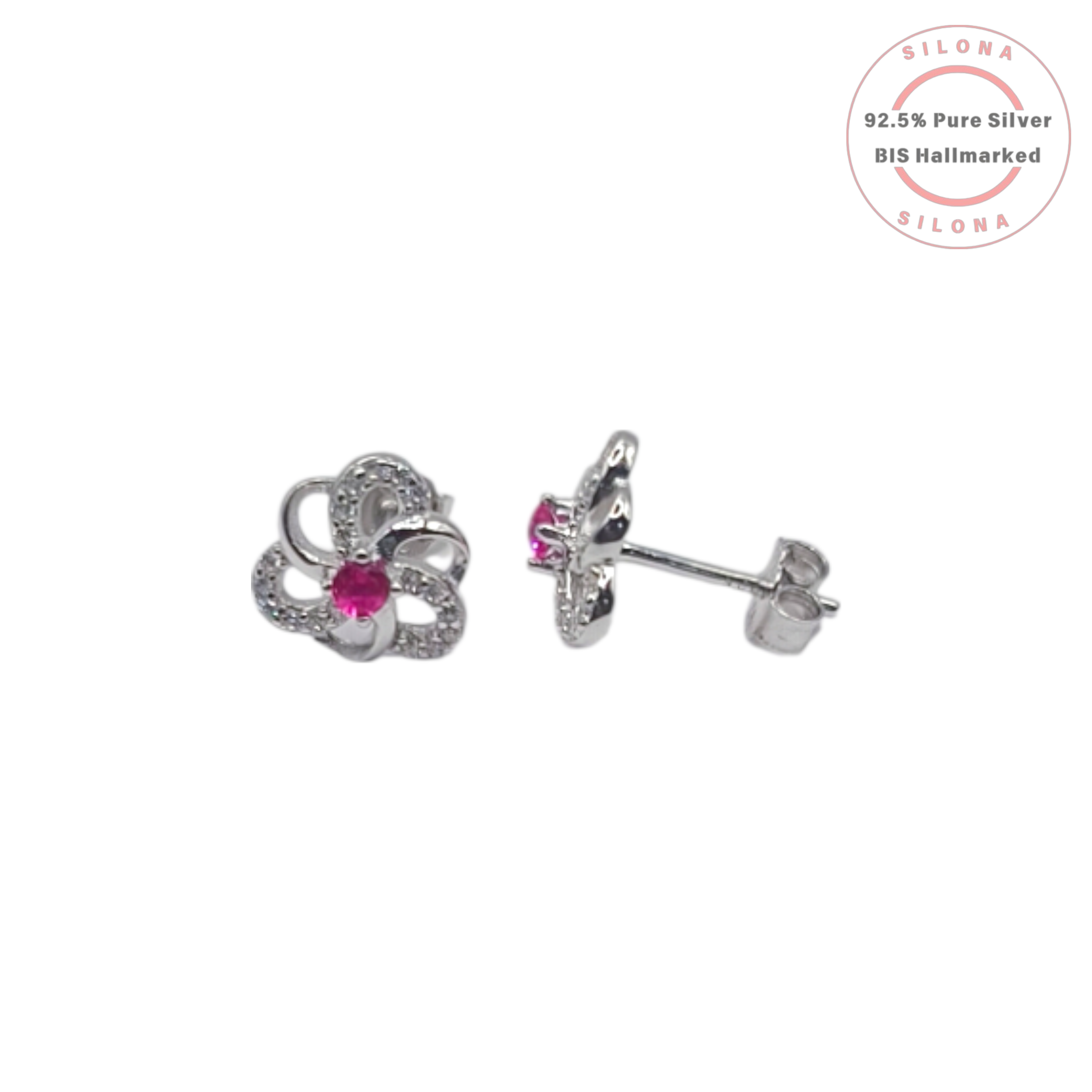 A pair of Silona silver floral stud earrings, each with a central ruby-pink stone and petals paved with clear cubic zirconia, on a white background.