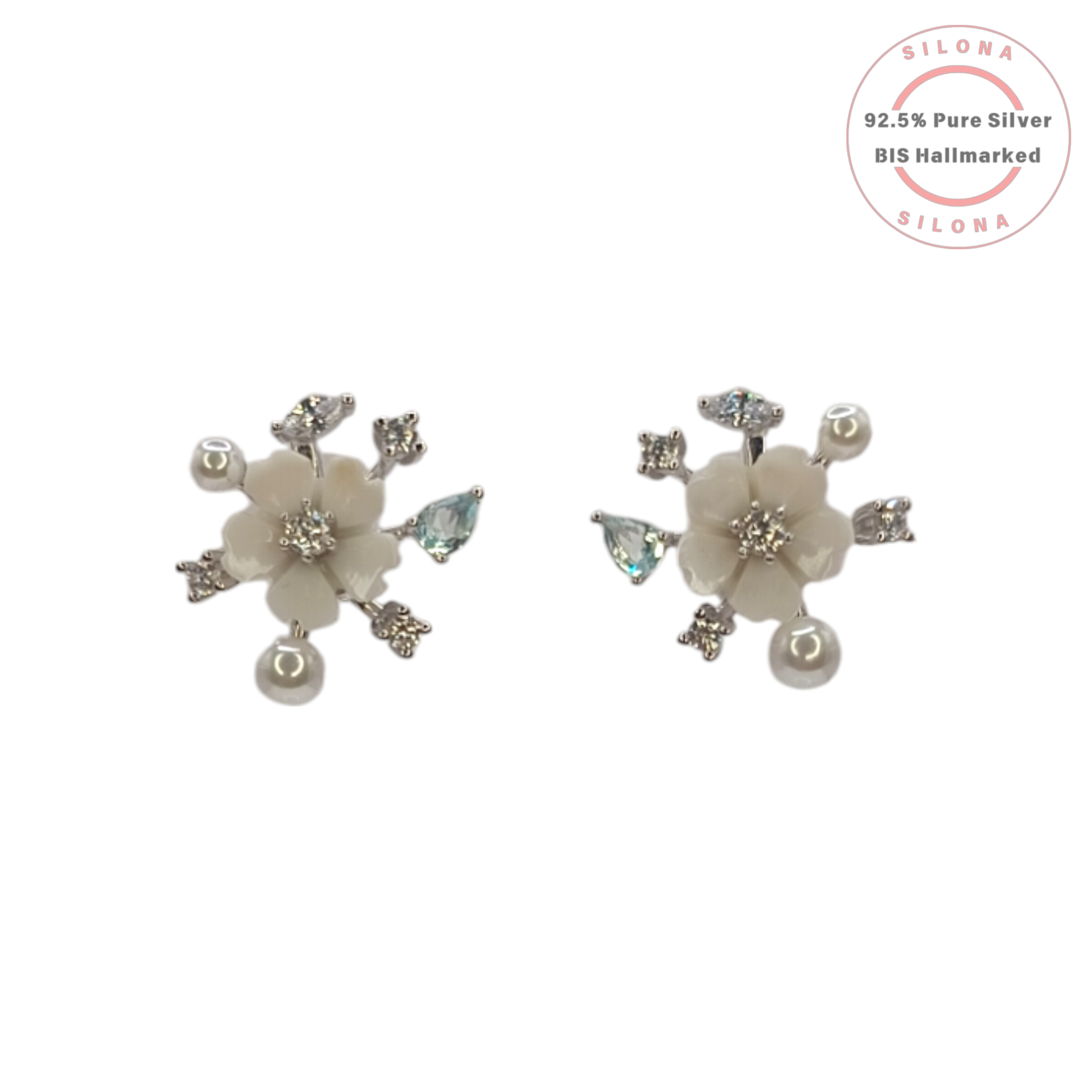 A pair of Silona Ethereal Blossom stud earrings, featuring carved mother of pearl flowers, pearls, and light blue cubic zirconia, set in 92.5 sterling silver, on a white background.