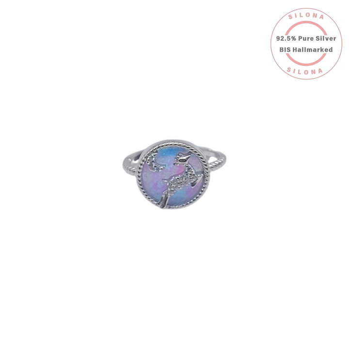 Silona's Iridescent Dolphin Ring in 92.5 silver, featuring a dolphin motif with cubic zirconia over a blue and purple background, on a white backdrop.