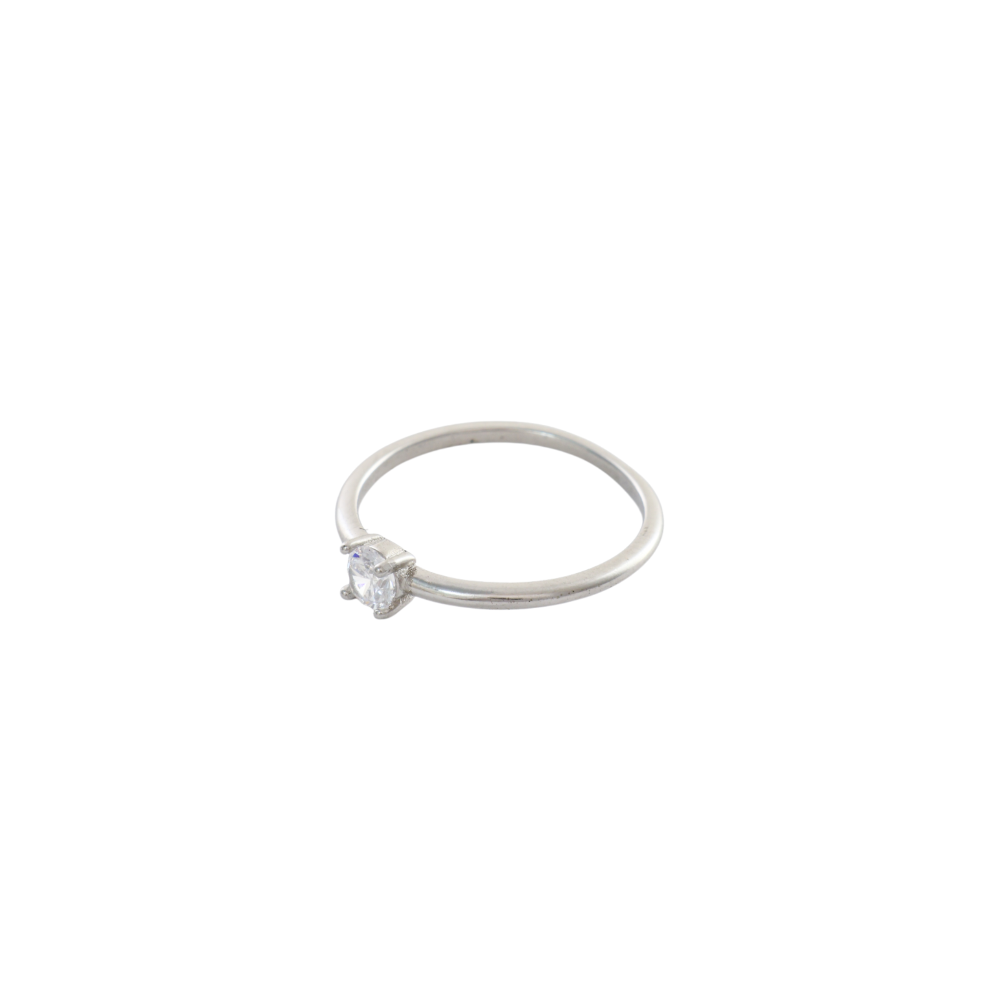 Dainty round solitaire clear gem set on a thin sterling silver band.